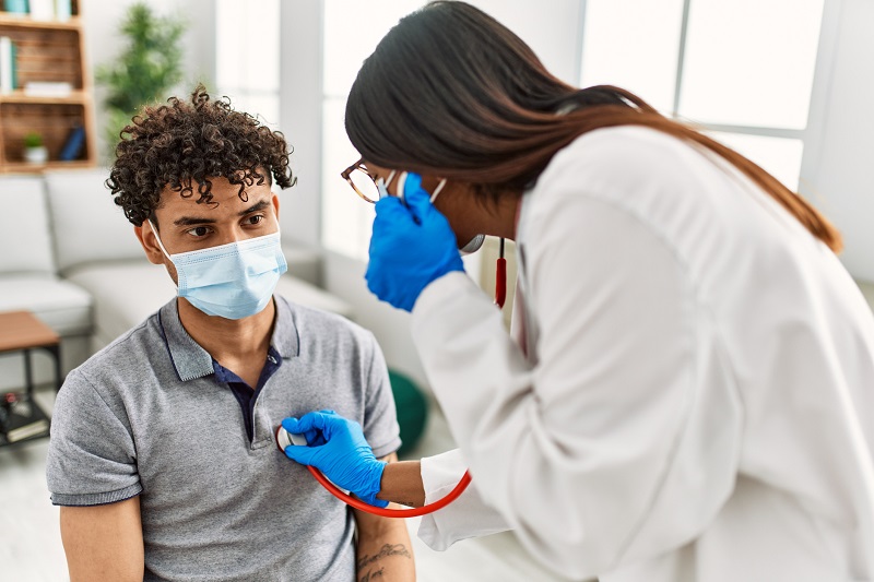 doctor checking patient